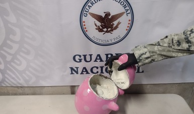 En Querétaro, Guardia Nacional detecta figura de cerdo artesanal con aparente cristal que sería enviada a Australia 